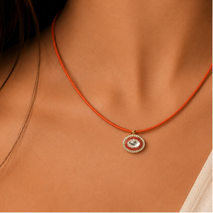 orange and red polki diamond with lab grown diamond halo coloured cord necklace on model